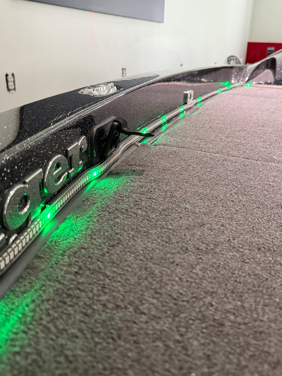 Close-up of the BeamSync LED strip lit green in its extrusion along the boat's gunwale
